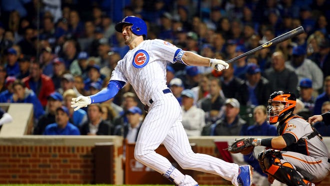 Game 1 in Chicago: Cubs third baseman Kris Bryant hits a double during the fourth inning.