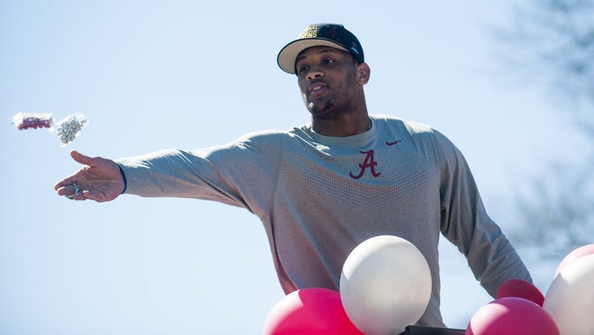 CFB National Championship Game MVP O.J. Howard throws trinkets from a parade float as the town of Autaugaville, Ala. holds a parade in honor of Howard on Saturday February 27, 2016.