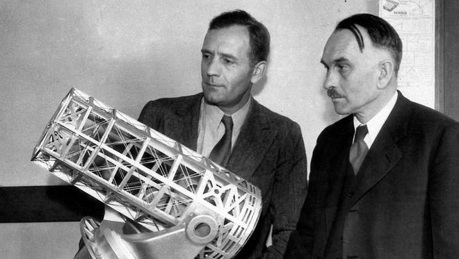 Dr. Edwin Hubble, and Dr. Richard Chase Tolman, right, a noted mathematician, inspect a model of a proposed 200-inch telescope for California. It was Hubble's observations and Tolman's calculations, that made Alfred Einstein change his mind about the Universe.