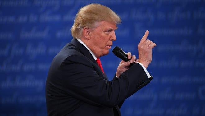 Republican presidential candidate Donald Trump makes a point during the second presidential debate at Washington University in St. Louis.