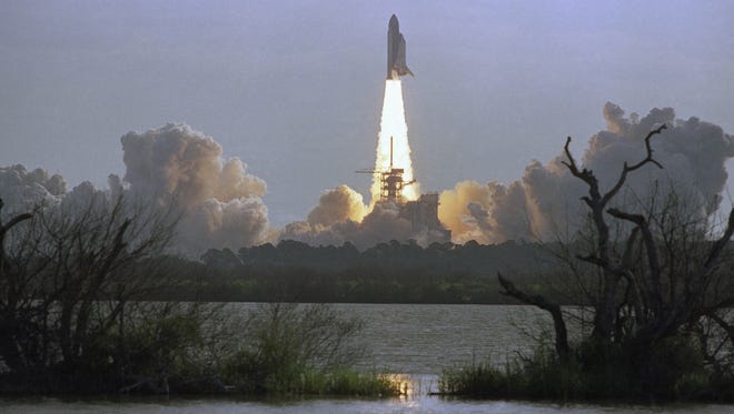 Space shuttle Discovery lifts off from Kennedy Space Center in Cape Canaveral, Fla. on April 24, 1990 carrying the Hubble Space Telescope.