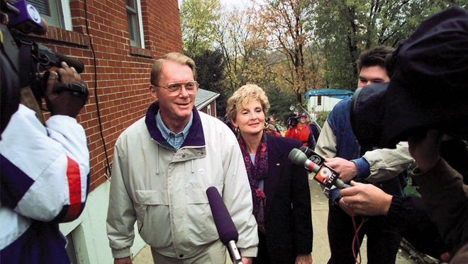 Kentucky Republican Senate candidate Jim Bunning walks with his wife Mary as he is surrounded by cameras after voting Tuesday morning, Nov. 3, 1998, in Southgate, Ky. Bunning is running against Democrat Scotty Baesler to fill the seat of retiring Sen. Wendell Ford. (AP Photo/Ed Reinke)