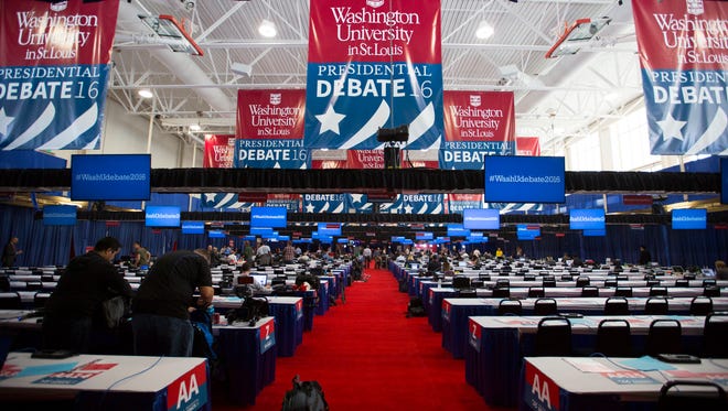 Journalists from all across the United States  work in the filing center at Washington University in St. Louis before the debate.