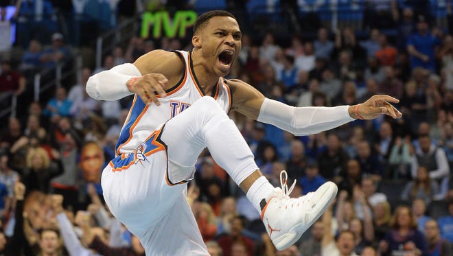 Oklahoma City Thunder guard Russell Westbrook (0) reacts after dunking the ball against the Memphis Grizzlies during the fourth quarter at Chesapeake Energy Arena.