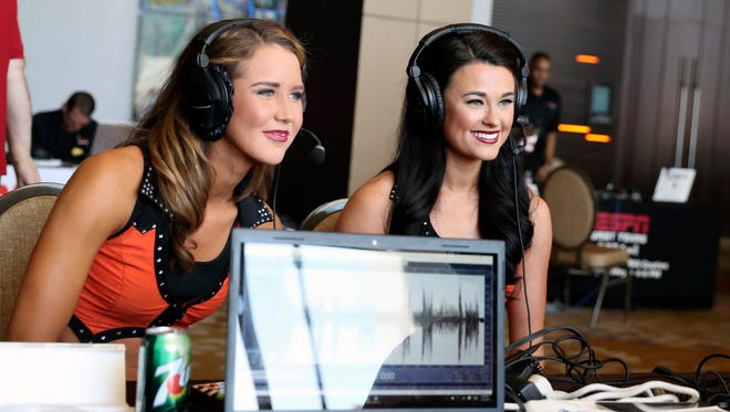 Oklahoma State Cowboys cheerleaders do an interview on radio row during the Big 12 Media Days at Omni Dallas Hotel.