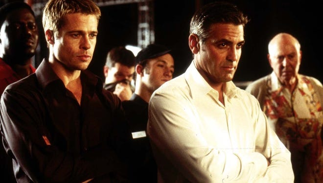 Brad Pitt  as Rusty Ryan and George Clooney as Danny Ocean star in Warner Bros. Pictures' and Village Roadshow Pictures' Ocean's Eleven.