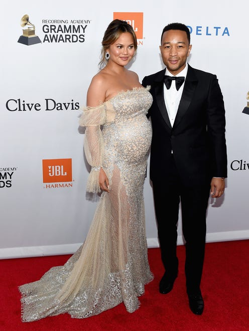 Chrissy showed off her growing baby bump in a sparkly and sheer dress alongside John at the Clive Davis and Recording Academy Pre-GRAMMY Gala the night prior.