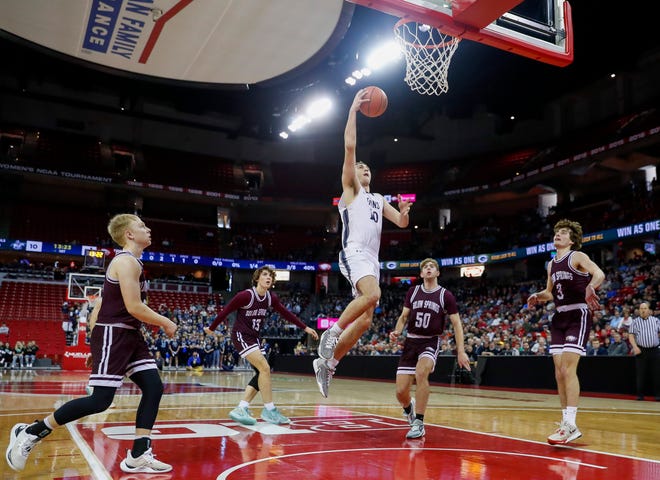 Columbus Catholic High School's Lucas Kreklau (10) goes up for a layup against Solon Springs High School in a Division 5 semifinal game during the WIAA state boys basketball tournament on Friday, March 15, 2024 at the Kohl Center in Madison, Wis. Columbus Catholic won the game, 78-65.