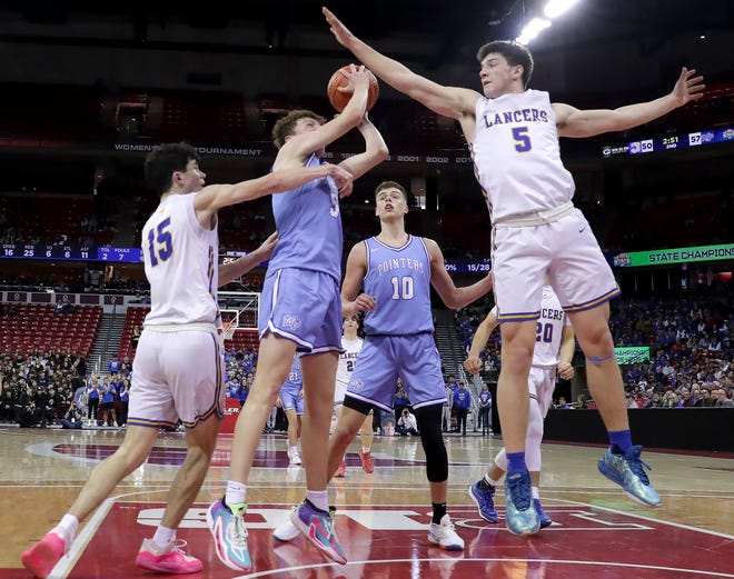 Kenosha St. Joseph's Tommy Santarelli (5),right. and Lowell Werlinger (15) against Mineral Point High School's Jaxson Wendhausen (5) in a Division 4 championship game during the WIAA state boys basketball tournament on Saturday, March 16, 2024 at the Kohl Center in Madison, Wis. Mineral Point High School defeated Kenosha St. Joseph 65-64.
Wm. Glasheen USA TODAY NETWORK-Wisconsin