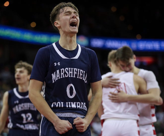 Columbus Catholic High School's Emmitt Konieczny (0) celebrates after defeating Abundant Life Christian School in the Division 5 state championship game during the WIAA state boys basketball tournament on Saturday, March 16, 2024 at the Kohl Center in Madison, Wis. Columbus Catholic won the game, 81-75.
