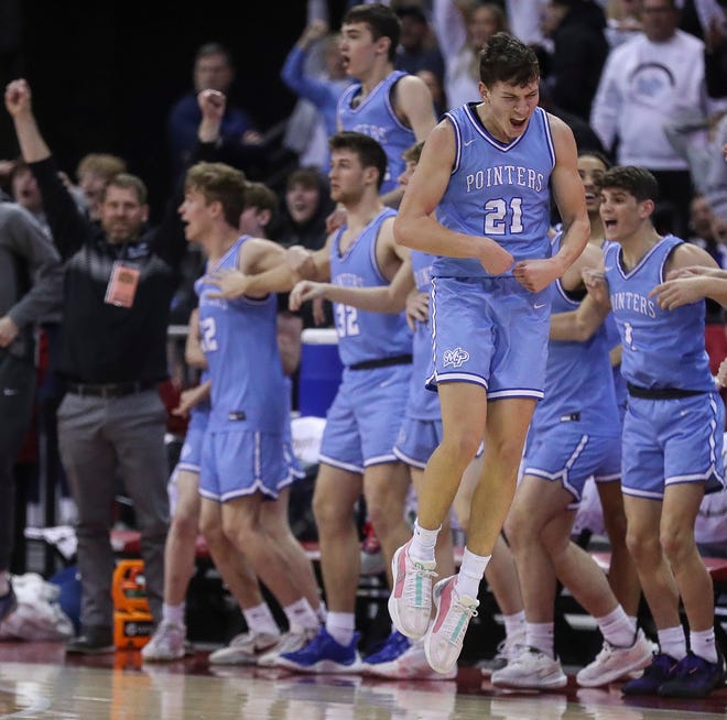 Mineral Point High School’s Drew Ashliman celebrates after scoring a go-ahead basket against Kenosha St. Joseph in the closing moments of the Division 4 state championship game during the WIAA state boys basketball tournament on Saturday, March 16, 2024 at the Kohl Center in Madison, Wis. Mineral Point won the game, 65-64, on a putback basket with 1.4 seconds remaining in the game.
