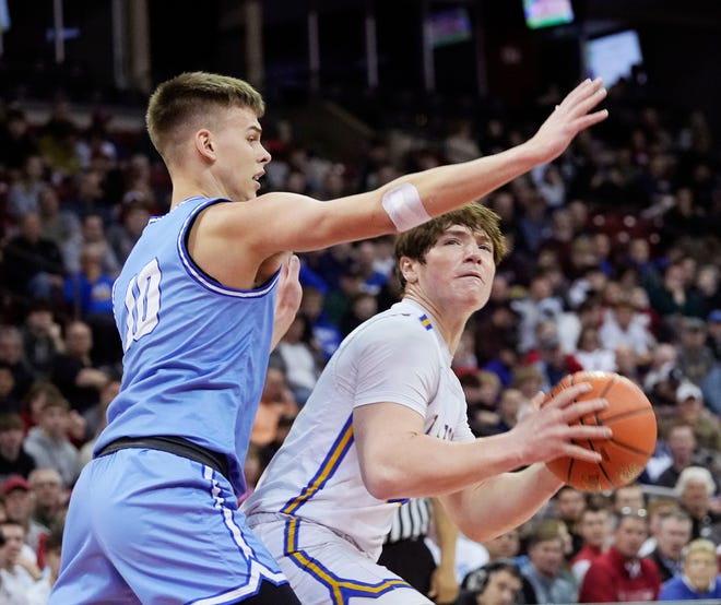 Mineral Point's Eli Lindsey (10) attempts to block Kenosha St. Joseph's Dominic Santarelli (23) during the first half of the WIAA Division 4 boys basketball state championship game on Saturday March 16, 2024 at the Kohl Center in Madison, Wis.
