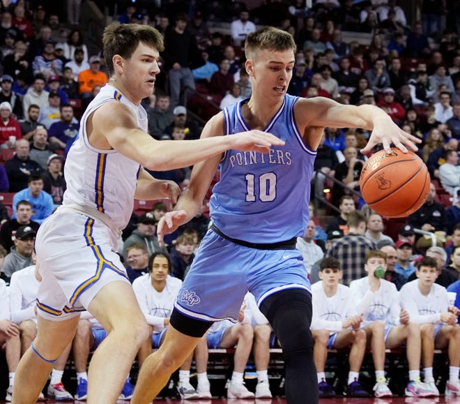 Mineral Point's Eli Lindsey (10) takes the ball from Kenosha St. Joseph's Tommy Santarelli (5) during the first half of the WIAA Division 4 boys basketball state championship game on Saturday March 16, 2024 at the Kohl Center in Madison, Wis.
