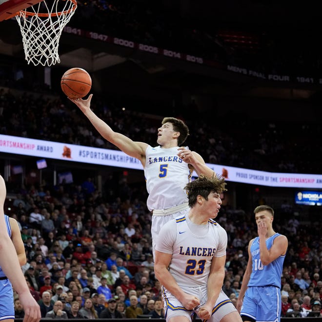 Kenosha St. Joseph's Tommy Santarelli (5) attempts to core during the second half of the WIAA Division 4 boys basketball state championship game against Mineral Point on Saturday March 16, 2024 at the Kohl Center in Madison, Wis.