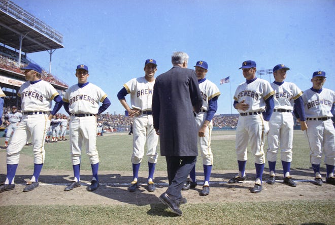 Wisconsin Governor Warren Knowles walks down the baseline shaking hands with Brewers players during the Brewers' first opening day on April 7, 1970. It was also the season opener for the Brewers. A crowd of 37,237 saw the Brewers fall to the California Angels 12-0.