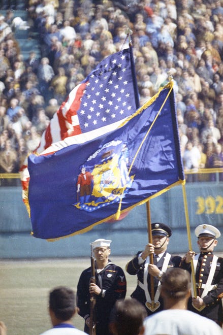A military honor guard presents the colors during the National Anthem at the Brewers' first opening day on April 7, 1970. The game was also the season opener for the Brewers. A crowd of 37,237 saw the Brewers fall to the California Angels 12-0.