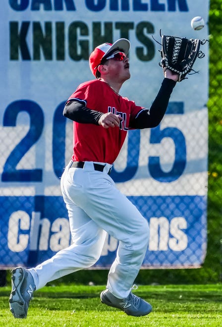 Racine Horlick left fielder Cam Gulotta (21) pulls in a fly during the game at Oak Creek, Friday, April 19, 2024.