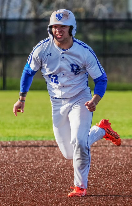 Oak Creek's Cade Palkowski (42) races for third during the game at home against Racine Horlick, Friday, April 19, 2024.