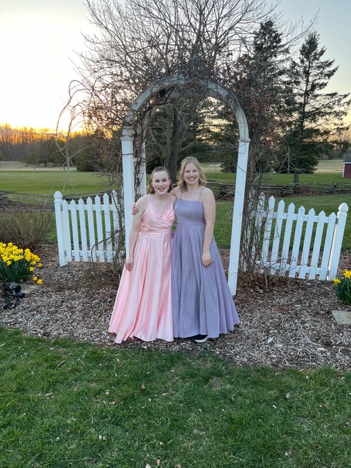 Josie and Abbie Hart pose for a photo together before heading to Hortonville High School's prom on Saturday, April 13, 2024.