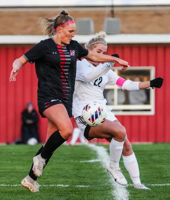Muskego's Norah Augustine, left, battles Waunakee's Sophie Schnaubelt (22) during the match at Muskego, Friday, April 19, 2024.