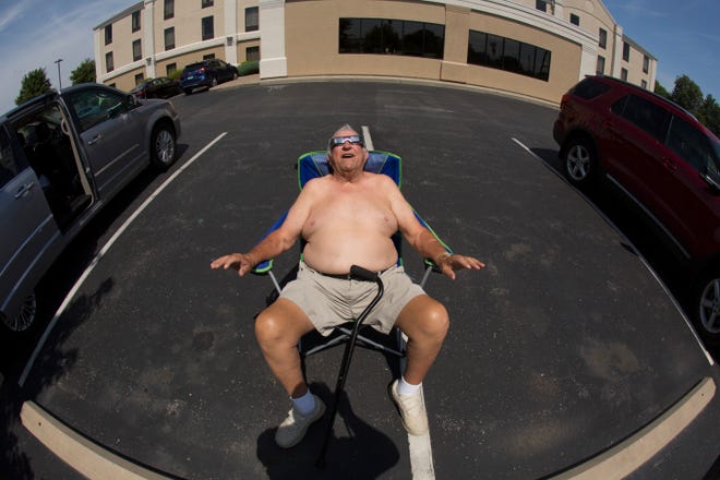 Clarence "Fuzzy" Blatz of Fond du Lac watches the solar eclipse on August 21, 2017, in Pacific, Mo. The totality of the eclipse lasted about 2 minutes and 24 seconds in the city about 32 miles southwest of St. Louis.