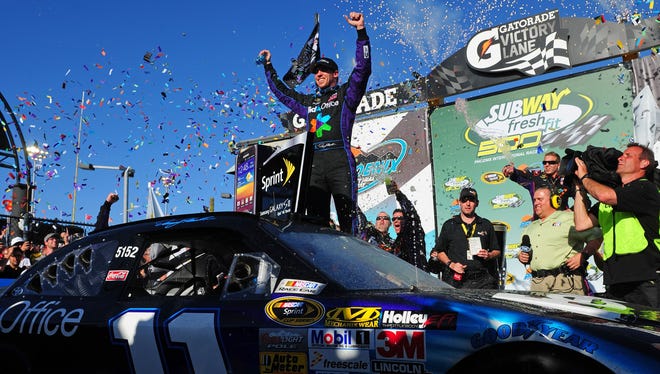 Denny Hamlin celebrates after winning the Subway Fresh Fit 500 at Phoenix International Raceway on March 4, 2012.