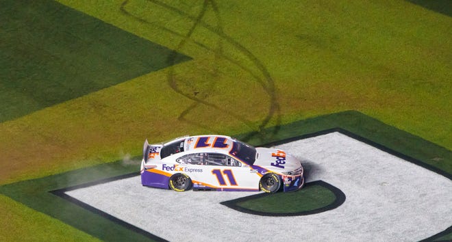Denny Hamlin does a burnout on the Daytona International Speedway infield after winning the 2020 Daytona 500 in the second-closest finish in the race's history.