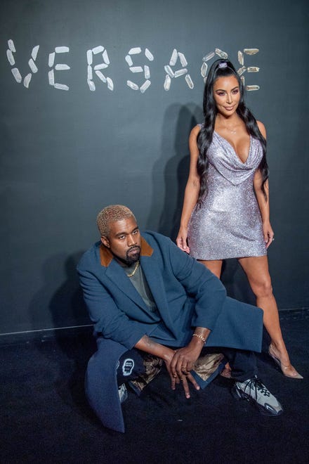 The frequently photographed couple showed they understood the importance of levels at the Versace Fall 2019 fashion show in New York on Dec. 2, 2018.