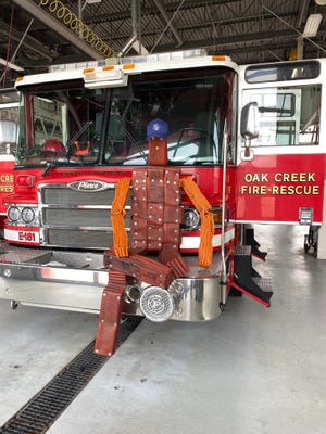 HOSE-A is a new training dummy for the Oak Creek Fire Department built from old rubber fire hose to be used for various training scenarios such as a downed firefighter or a civilian rescued from a building via ladder.